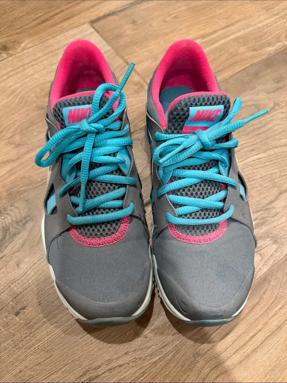 Nike Women's Gray Athletic Sneakers with Teal Laces and Pink Interior